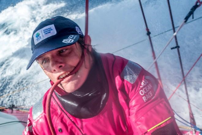 Leg six to Newport onboard Team SCA. Day 10. Liz Wardley grips the FR0 halyard in her teeth. - Volvo Ocean Race 2015 © Corinna Halloran / Team SCA