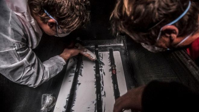 Mapfre gluing spare battens in the forward sections of the boat because of the pounding - the extra strengthening was ruled illegal - Volvo Ocean Race Leg 5 © Francisco Vignale/Mapfre/Volvo Ocean Race