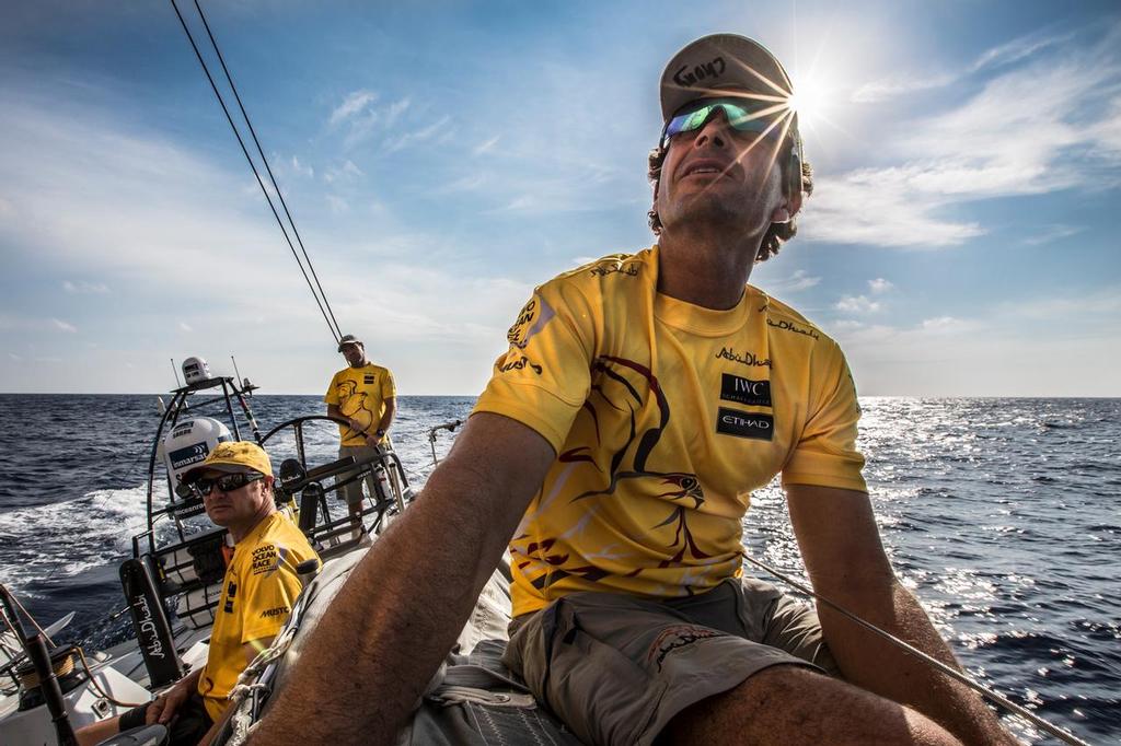 April 20, 2015. Leg 6 Newport onboard Abu Dhabi Ocean Racing. Day 1.  Roberto Bermudez 'Chuny' keeps his eye on sail trim as the team closes down Alvimedica. photo copyright Matt Knighton/Abu Dhabi Ocean Racing taken at  and featuring the  class