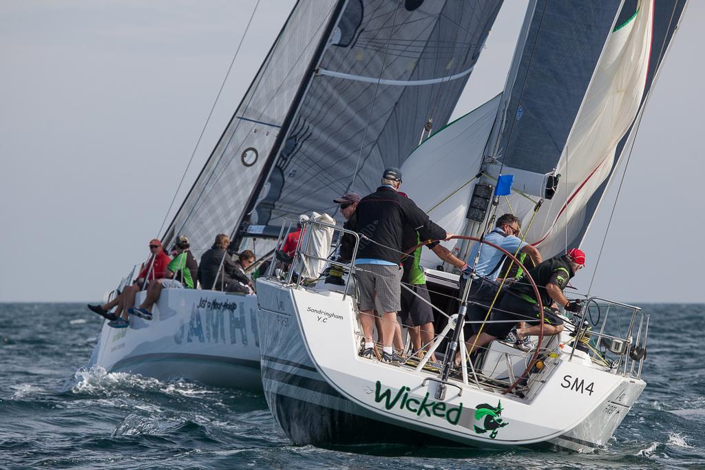 Wicked round the leeward gate with just the last few metres of spinnaker to retrieve. - 2014/15 Club Marine Series ©  Alex McKinnon Photography http://www.alexmckinnonphotography.com