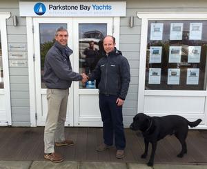 Liz_Rushall_Dave Richards from Elvstrom congratulates Jimmy Warrington Smyth from Parkstone Bay Yachts photo copyright Liz Rushall taken at  and featuring the  class