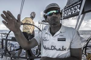 Leg six Newport onboard Abu Dhabi Ocean Racing. Day five. Roberto Bermudez 'Chuny' gives wind input to Ian Walker at the helm in the morning as they try to catch up to the rest of the fleet in light winds. - Volvo Ocean Race 2015 photo copyright Matt Knighton/Abu Dhabi Ocean Racing taken at  and featuring the  class