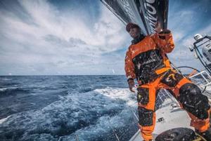Seb Marsset peaks to leeward to critique the jib trim as spray shoots over the deck. - Leg six to Newport – Volvo Ocean Race 2015 photo copyright  Amory Ross / Team Alvimedica taken at  and featuring the  class