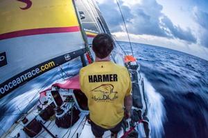 Onboard Abu Dhabi Ocean Racing – Phil Harmer illuminates the headsails at dusk to check the trim - Leg six to Newport – Volvo Ocean Race 2015 photo copyright Matt Knighton/Abu Dhabi Ocean Racing taken at  and featuring the  class