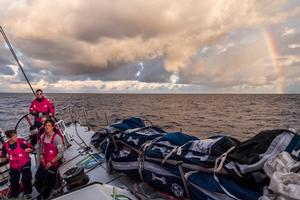 April 23,2015. Leg 6 to Newport onboard Team SCA. Day 4. Sam Davies helms during a tack with Abu Dhabi Ocean Racing sailing into a rainbow. photo copyright Corinna Halloran / Team SCA taken at  and featuring the  class