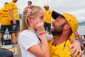 Victorious Volvo Ocean Race leg five skipper Ian Walker is welcomed to the Itajai pontoons by his daughter - Volvo Ocean Race 2015 photo copyright  Ian Roman / Abu Dhabi Ocean Racing taken at  and featuring the  class