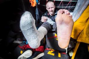 Oboard Abu Dhabi Ocean Racing - After two weeks in the Southern Atlantic, if you're feet are dry you're in good shape. Justin Slattery shows how it's done - Leg five to Itajai -  Volvo Ocean Race 2015 photo copyright Matt Knighton/Abu Dhabi Ocean Racing taken at  and featuring the  class