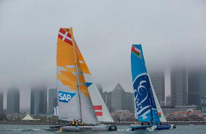 SAP Extreme Sailing Team and The Wave, Muscat sail through the fog towards the city - Act 3, Qingdao 2015 - Day two © Lloyd Images