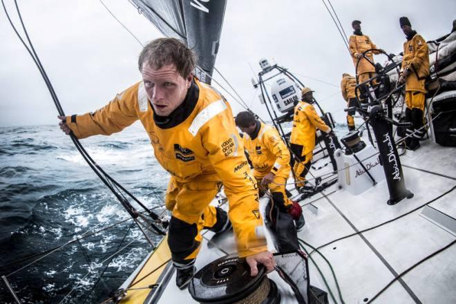  Leg 7 to Lisbon onboard Abu Dhabi Ocean Racing. Day 8. Luke ``Parko`` Parkinson pulls the running backstay forward during a sail change en route to Lisbon. - Volvo Ocean Race 2015 © Matt Knighton/Abu Dhabi Ocean Racing
