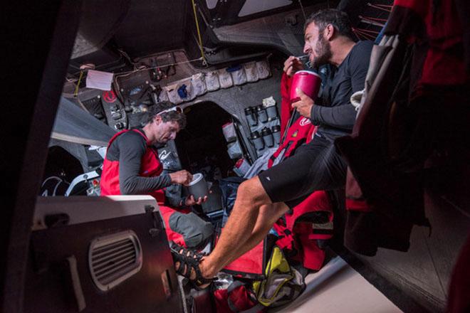 Leg 6 to Newport onboard Dongfeng Race Team. Day 15. Not your typical family dinner; Thomas Rouxel and Eric Peron rest and refuel before their next watch.  © Sam Greenfield/Dongfeng Race Team/Volvo Ocean Race