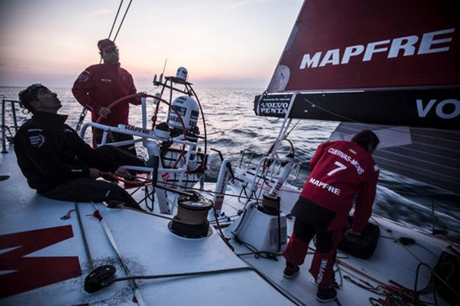 Leg 7 to Lisbon onboard MAPFRE. Day 00. iker Martinez on the helm just before sunset; was beginning to getting cold.  © Francisco Vignale/Mapfre/Volvo Ocean Race