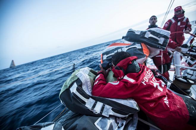 Leg 7 to Lisbon onboard MAPFRE. Day 04. Andre Fonseca looking at Abu Dhabi while Willy Altadil and Iker Martinez sail the boat © Francisco Vignale/Mapfre/Volvo Ocean Race