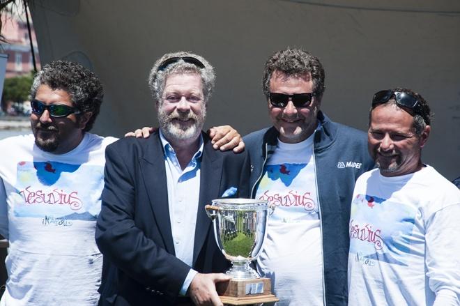 Shirlaf owner Giuseppe Puttini, with Paolo Cian (right), is presented with the trophy for overall handicap honours - 2015 Volcano Race © IMA/Gianluca Di Fazio