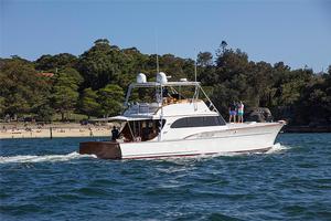 Classic Sportsfisherman, resplendent with Mahogany transom as well... photo copyright  John Curnow taken at  and featuring the  class