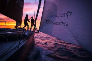 Leg 6 to Newport onboard Team Alvimedica. The sunset silhouettes the foredeck during a change from the masthead Code Zero to the A3 spinnaker. With less than 500 miles to Newport the complex winds again lighten before another cold front and an overnight forecast calling for the return of stronger winds. - Volvo Ocean Race 2015 photo copyright  Amory Ross / Team Alvimedica taken at  and featuring the  class