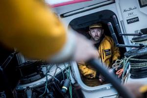 Onboard Abu Dhabi Ocean Racing - Ian Walker stares through the hatch during a tactical debate about the wind down towards the finish in Lisbon - Leg 7 to Lisbon - Volvo Ocean Race photo copyright Matt Knighton/Abu Dhabi Ocean Racing taken at  and featuring the  class
