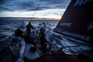Leg 7 to Lisbon onboard MAPFRE. Day 03. Iker Martinez,Antonio Cuervas-Mons '„eti' and Willy Altadill on the late watch with the sun going down. - Volvo Ocean Race 2015 photo copyright Francisco Vignale/Mapfre/Volvo Ocean Race taken at  and featuring the  class