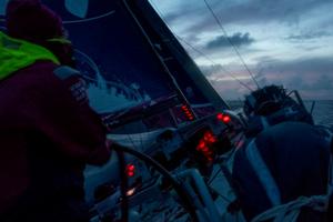 Leg 6 to Newport onboard Team SCA. Day 15. Annie Lush helms during the 'blue hour' shortly after sunset. photo copyright Corinna Halloran / Team SCA taken at  and featuring the  class
