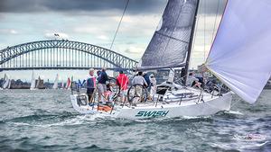 Swish crosses the Harbour Bridge en route to Kirrbilli Mark in Race 4 of the CYCA Winter Series last Sunday. photo copyright Beth Morley - Sport Sailing Photography http://www.sportsailingphotography.com taken at  and featuring the  class