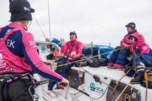 Onboard Team SCA - Carolijn Brouwer is giving the 1900 UTC position. Good news compared to the one at 1400. Abby Ehler,Sara Hastreiter and Sophie Ciszek on watch - Leg 7 to Lisbon - Volvo Ocean Race photo copyright Anna-Lena Elled/Team SCA taken at  and featuring the  class