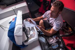 Day 1. A broken water maker. Eric Peron reads the instructions for the spare. photo copyright Sam Greenfield/Dongfeng Race Team/Volvo Ocean Race taken at  and featuring the  class