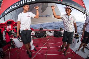 Day 4. Liu Xue 'Black' and Jin Hao Chen 'Horace' enjoying a conversation that no one else onboard understands. photo copyright Sam Greenfield/Dongfeng Race Team/Volvo Ocean Race taken at  and featuring the  class