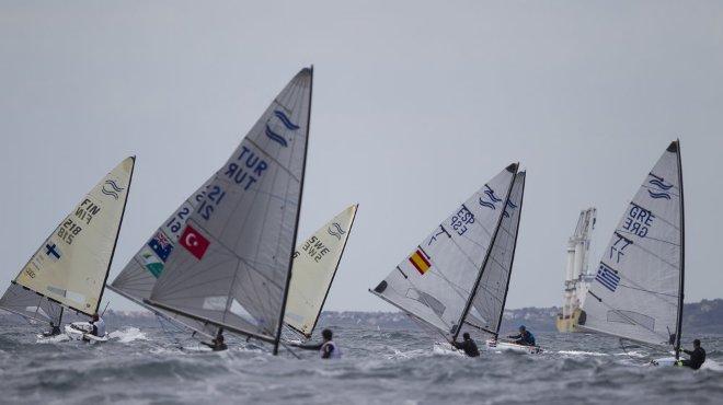 Men's One Person Dinghy Heavy (Finn) Fleet on day one - ISAF Sailing World Cup Weymouth and Portland © onEdition http://www.onEdition.com