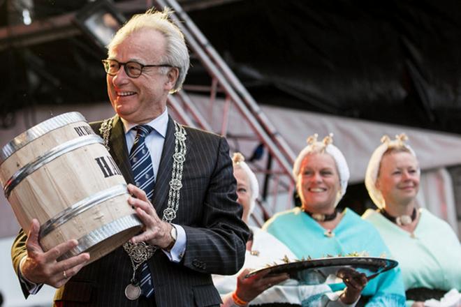  June 18,2015. Jozias Johannes van Aartsen,mayor of The Hague and Knut Frostad,Volvo Ocean Race CEO,receive a Herring,as a Dutch tradtion,during the race village opening ceremony.  © Victor Fraile/Volvo Ocean Race http://www.volcooceanrace.com