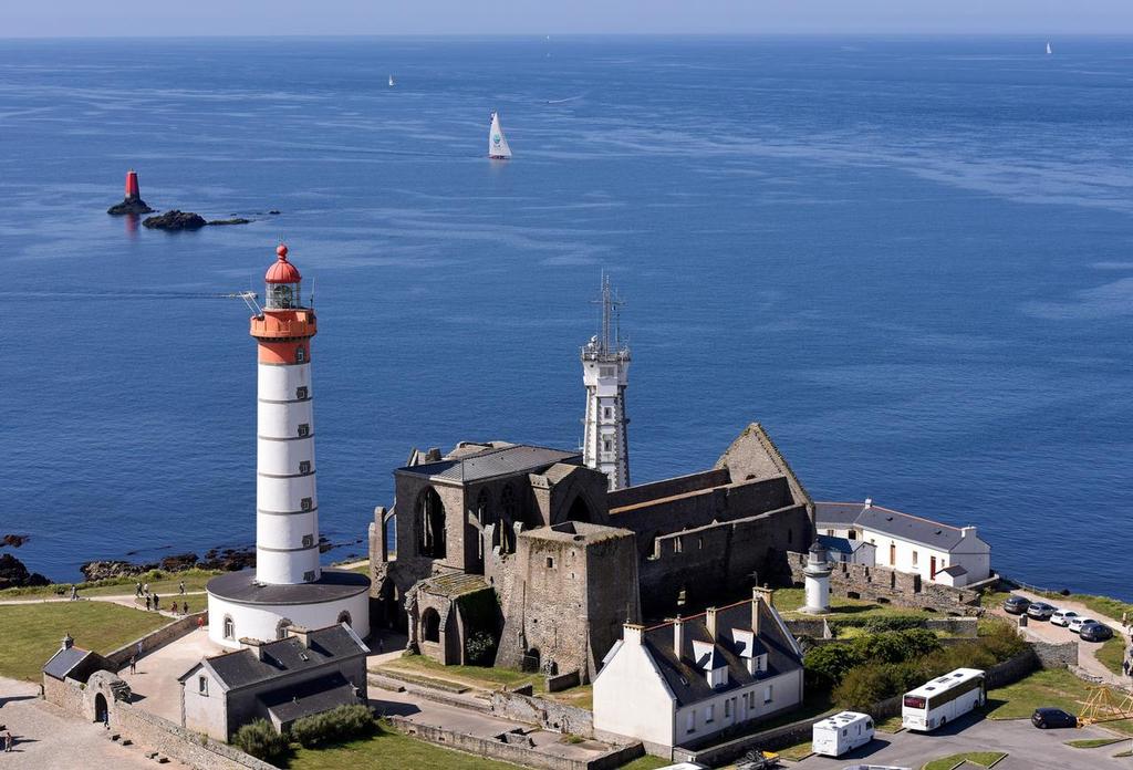June 17 2015 Volvo Ocean Race Leg 9 Lorient to Gothenburg via The Hague. <br />
Boats close to Ushant NW Brittany France by the Kermorvan lighthouse<br />
 © Rick Tomlinson/Volvo Ocean Race http://www.volvooceanrace.com