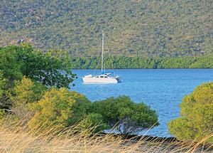 Cruising cat lies at anchor in Princess Charlotte Bay. photo copyright  John Curnow taken at  and featuring the  class