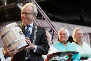  June 18,2015. Jozias Johannes van Aartsen,mayor of The Hague and Knut Frostad,Volvo Ocean Race CEO,receive a Herring,as a Dutch tradtion,during the race village opening ceremony. photo copyright Victor Fraile/Volvo Ocean Race http://www.volcooceanrace.com taken at  and featuring the  class