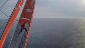 Onboard Dongfeng Race Team - Eric Peron spends the morning up the mast fixing a small hole in the MH0 - Leg 8 to Lorient – Volvo Ocean Race 2015 photo copyright Yann Riou / Dongfeng Race Team taken at  and featuring the  class