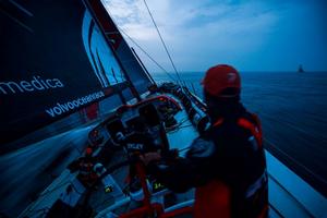 Onboard Team Alvimedica - Mark Towill driving at nightfall with MAPFRE approaching from the east - Leg 8 to Lorient – Volvo Ocean Race 2015 photo copyright  Amory Ross / Team Alvimedica taken at  and featuring the  class