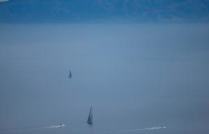 Misty farewell: Wild Oats XI pursues a lone catamaran while making a misty exit from Los Angeles in the race to Hawaii - 2015 Transpac Race photo copyright Sharon Green/ ultimatesailing.com http://www.ultimatesailing.com taken at  and featuring the  class
