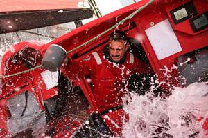 Wet conditions onboard for Eric Peron as he even uses it to his advantage to wash the dishes! - 2015 Volvo Ocean Race photo copyright Yann Riou / Dongfeng Race Team taken at  and featuring the  class