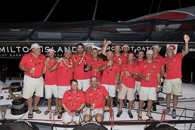 Mark Richards (with champagne bottle), and Roy P. Disney (on his right), celebrate with the crew aboard Wild Oats XI following the finish of the Transpac Race from Los Angeles to Honolulu ©  Sharon Green / Ultimate Sailing