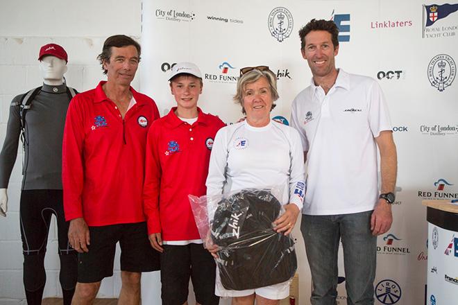 The Royal Hong Kong Yacht Club team collecting the day's prizes courtesy of sponsor Zhik © Emma Louise Wyn Jones Photography