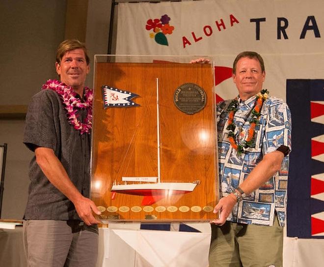 Keith Kilpatrick (left) won the Don Vaughn Memorial Trophy as Outstanding Crewman on Rio 100, presented by TPYC Vice Commodore Bo Wheeler ©  Sharon Green