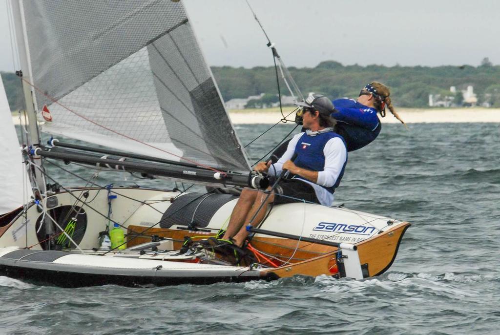 Andrew Jones (helm) and Arielle Darrow (crew) are all smiles upwind on Saturday. © Jerry Woelfel