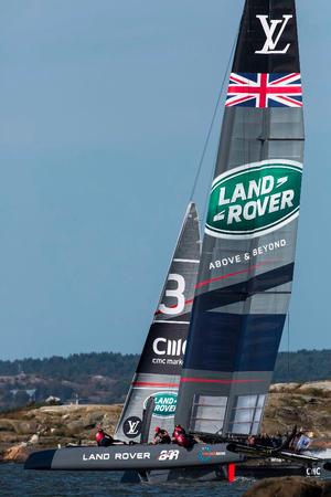 Land Rover BAR sail close to shore in race one - 2015 America's Cup World Series photo copyright Lloyd Images taken at  and featuring the  class