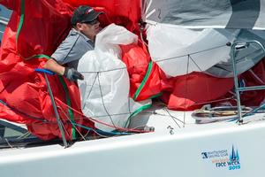 Bowman lost in a jumble of sails on More Noise yesterday - 2015 Airlie Beach Race Week photo copyright Andrea Francolini / ABRW taken at  and featuring the  class