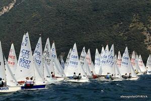 The big fleet of Cadets lining up for the start of racing on day 3 on Italy's Lake Garda. photo copyright  Elena Giolai/Fraglia Vela Riva taken at  and featuring the  class