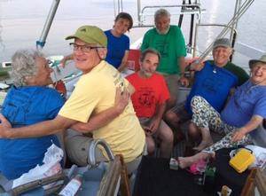 The 2015 PCCR T-shirts modelled by Dawn, Ian, Donna, Bob, Frank, Blake, and JJ aboard Dulcinea II. - 2015 Peterson Cup Cruising Rally photo copyright Bluewater Cruising Association taken at  and featuring the  class