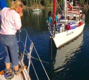 Heather on Blue Rose and Amanda on Papa Rumba patiently untangling the anchor rodes. - 2015 Peterson Cup Cruising Rally photo copyright Bluewater Cruising Association taken at  and featuring the  class