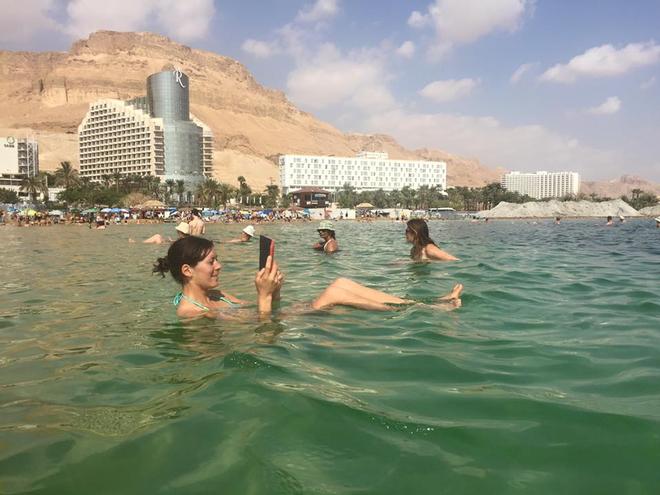 Jo Aleh relaxing in the Dead Sea, ahead of the 2015 470 Worlds in Haifa, Israel © Powrie Images
