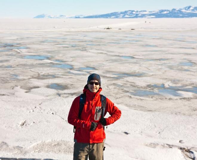 The study's lead author, Luke Trusel, standing in front of sea ice covered in melt ponds in December 2010 outside of McMurdo Station, Antarctica © Luke Trusel
