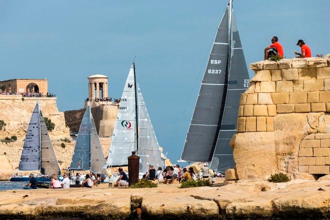 Fleet passing close to the shore as they start the 608 nautical mile racecourse - 2015 Rolex Middle Sea Race © Rolex/ Stefano Gattini http://www.rolex.com