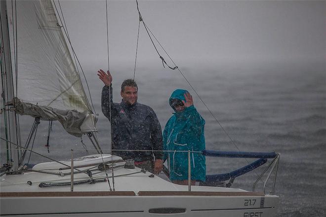 The smallest boat out there, Sweet Cheeks, came past to check in during the downpour… - 2015 Beneteau Cup ©  John Curnow