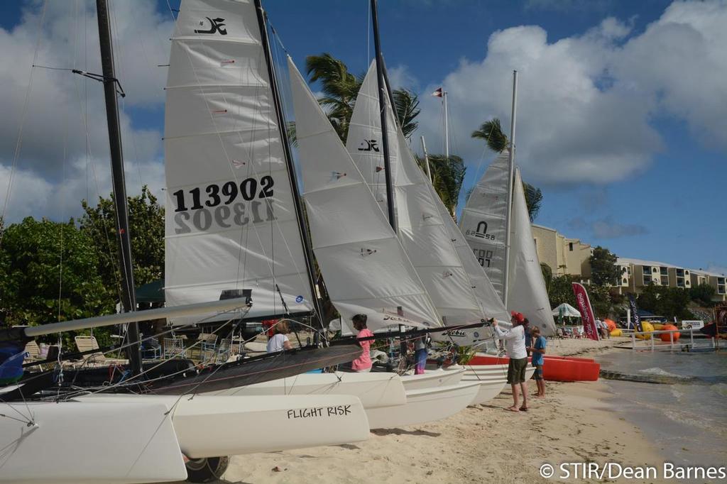 Beach cats lined up and ready to race on the STYC beach in St. Thomas, U.S. Virgin Islands. © Dean Barnes