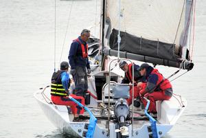 Storm Dragon's crew discuss starting line tactics photo copyright Peter Campbell taken at  and featuring the  class